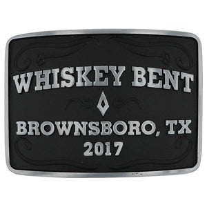 Close-up of Brownsboro Whiskey Bent Western Belt Buckle – A rectangular western belt buckle with a deep black background, silver-tone "Whiskey Bent" lettering, and intricate filigree detailing.
